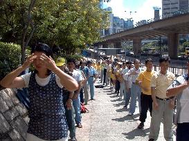 Falun Gong followers urge Beijing to stop persecuting